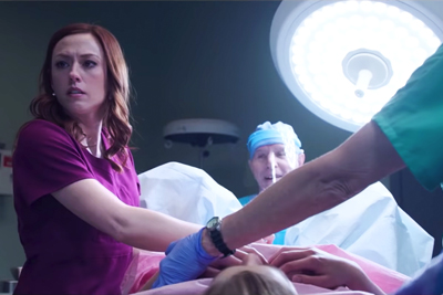 [Photo: Abby Johnson (played by actress Ashley Bratcher) shows concern during an abortion procedure scene from the movie Unplanned.]